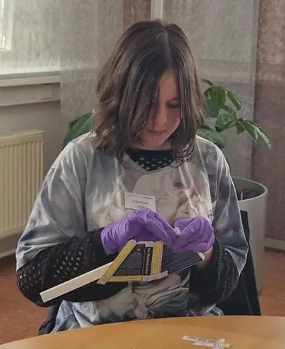 Image 5: A girl works intently and with great care on her spectroscope. None of the girls glance at their phones; they are all polite, and many feel comfortable asking questions openly. We are very excited about this generation of bright young talents.